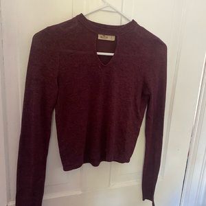 Small maroon ish long sleeve shirt with chest cut out